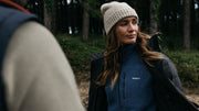 woman wearing finisterre coat and fleece