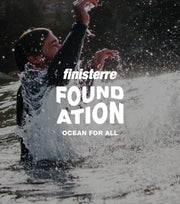 Two women swimming wearing the Finisterre Seasuit