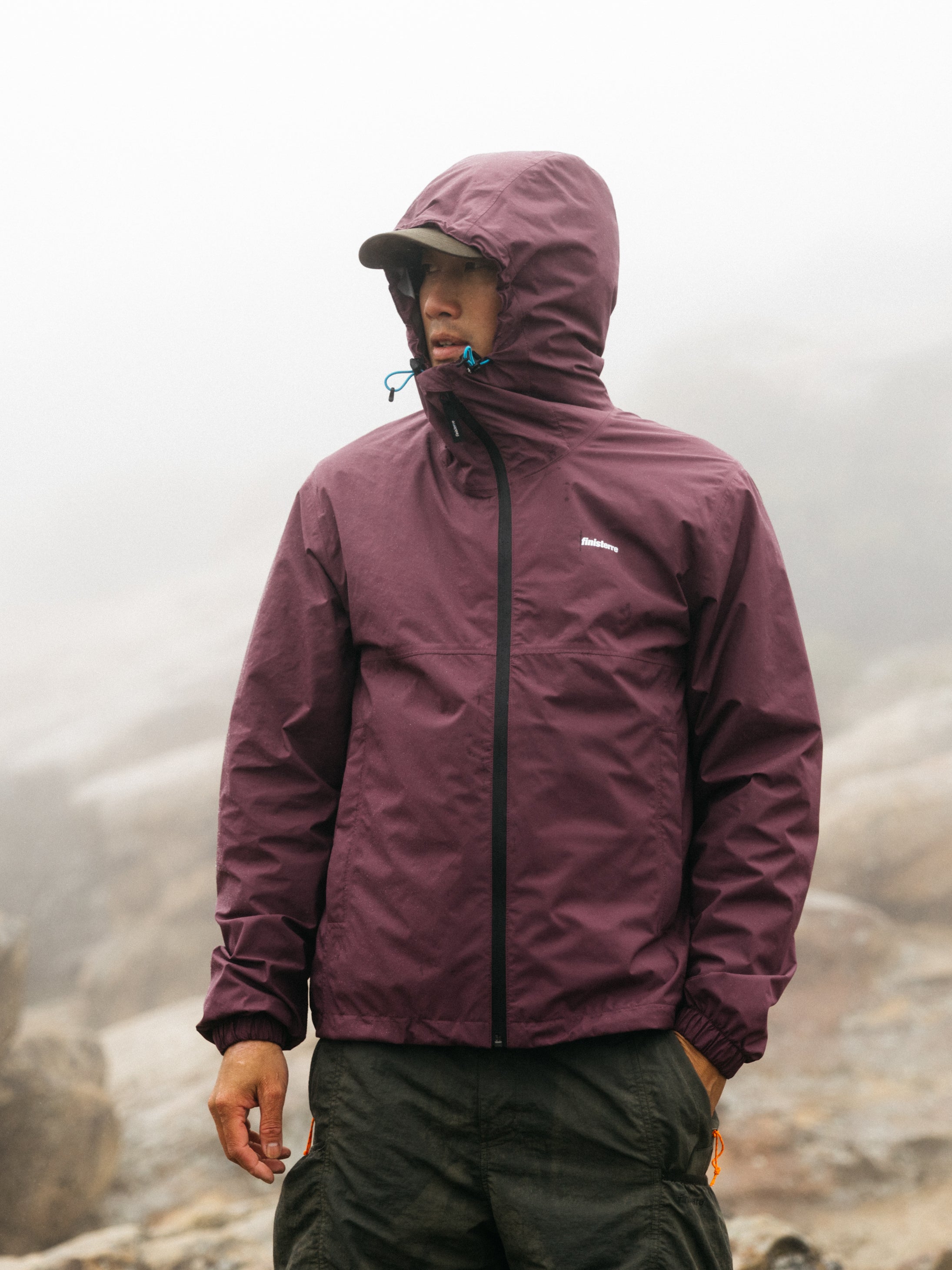 The Rainbird Waterproof Jacket in Fig Purple Finisterre